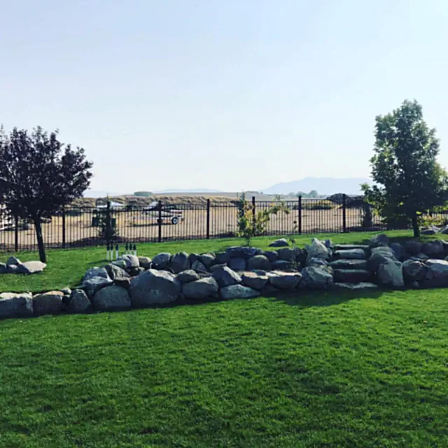 Granite boulder retaining wall built into a Northern Nevada hillside