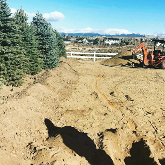 Irrigation lines being installed across a prepared Northern Nevada yard