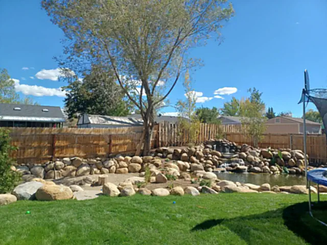 Full landscape installation with new trees and rock beds in Carson City