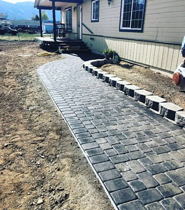 Interlocking paver walkway curving through a finished Carson Valley yard